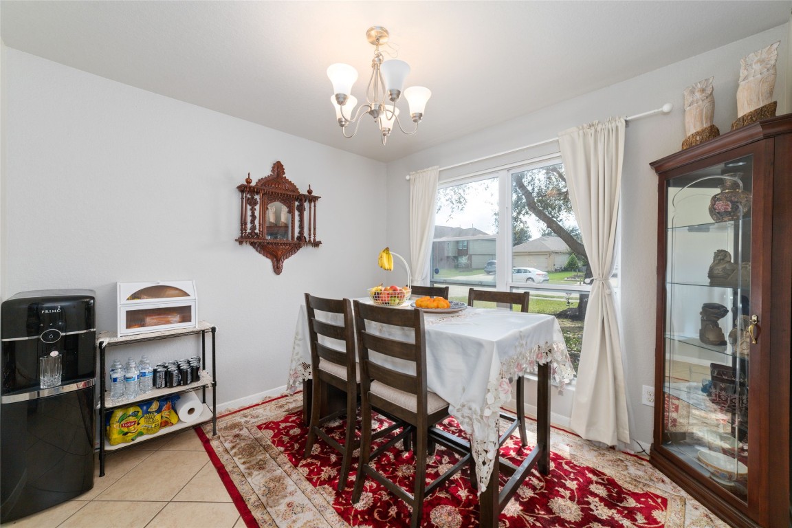 3038 Winchester Rnch Trail Katy, TX 77493 - Photo 14 of 29 a view of a dining room with furniture window and outside view