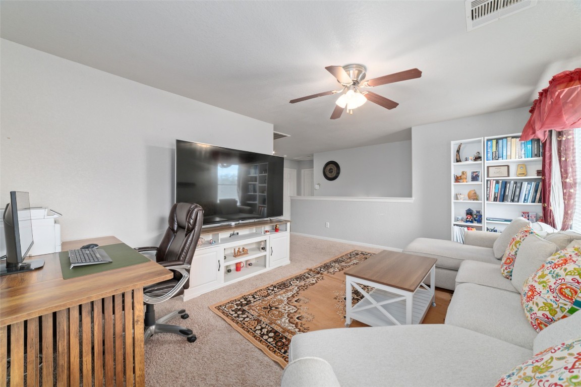 3038 Winchester Rnch Trail Katy, TX 77493 - Photo 18 of 29 a living room with furniture and a flat screen tv