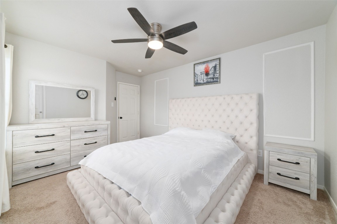 3038 Winchester Rnch Trail Katy, TX 77493 - Photo 24 of 29 a bedroom with a bed and a dresser