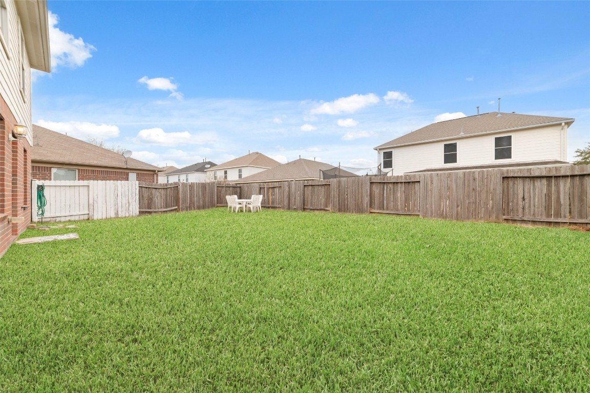 3038 Winchester Rnch Trail Katy, TX 77493 - Photo 29 of 29 a front view of a house with a yard and garage
