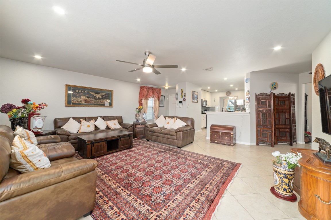 3038 Winchester Rnch Trail Katy, TX 77493 - Photo 7 of 29 a living room with furniture and a chandelier