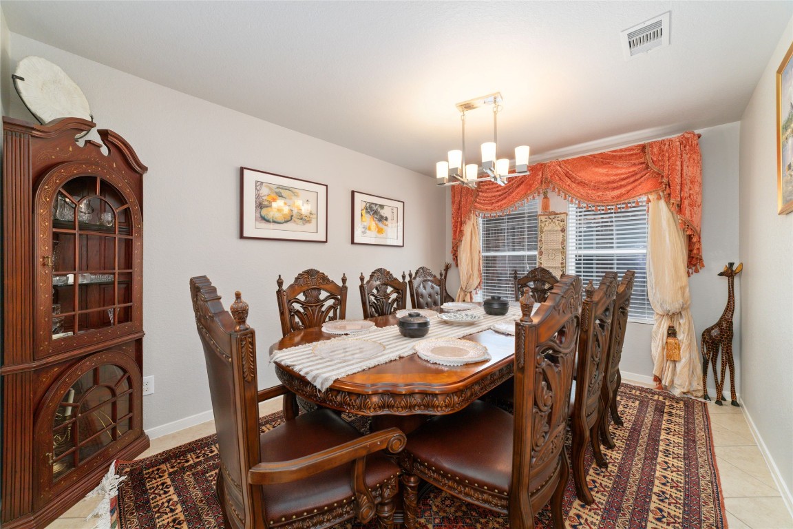 3038 Winchester Rnch Trail Katy, TX 77493 - Photo 9 of 29 a view of a dining room with furniture and chandelier