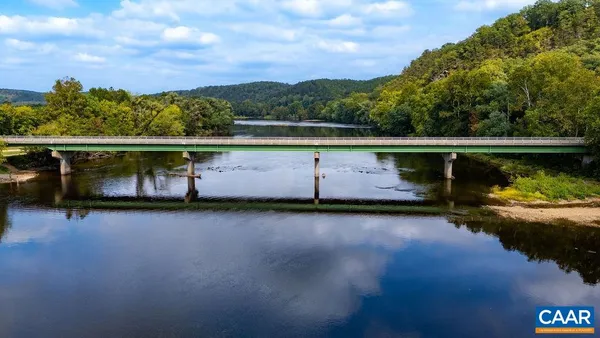 a view of swimming pool with a lake view
