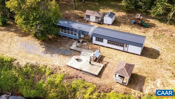 a view of a lake with a yard