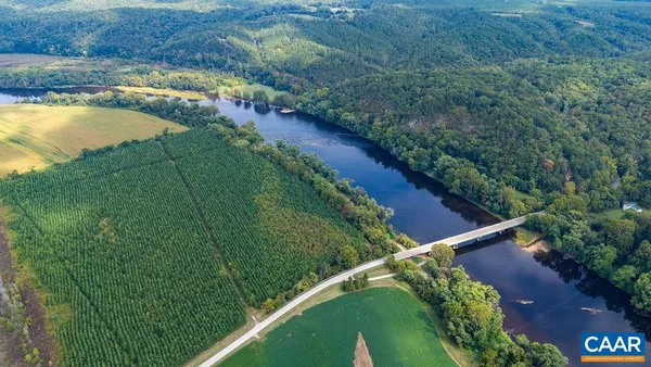 a view of a lake with huge green field