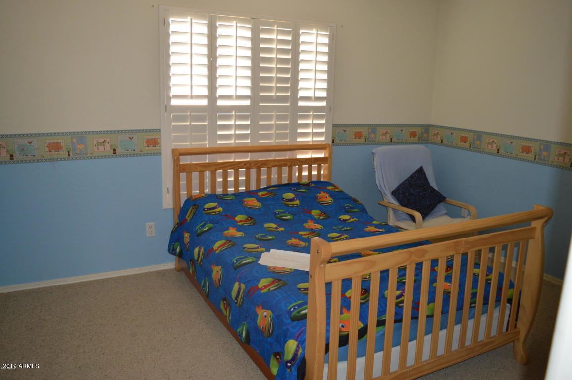 4351 East Pinto Valley Road San Tan Valley, AZ 85143 - Photo 15 of 27 a bedroom with a bed and a window
