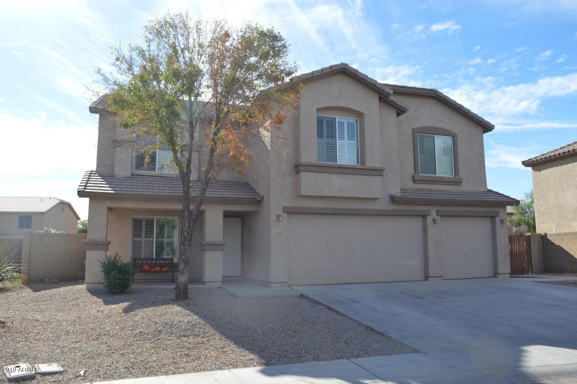 4351 East Pinto Valley Road San Tan Valley, AZ 85143 - Photo 2 of 27 a front view of a house with a yard and garage