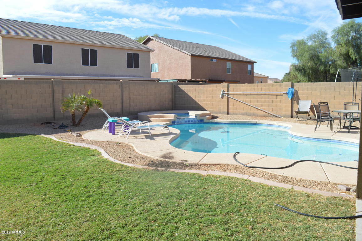 4351 East Pinto Valley Road San Tan Valley, AZ 85143 - Photo 23 of 27 a view of a backyard with table and chairs potted plants