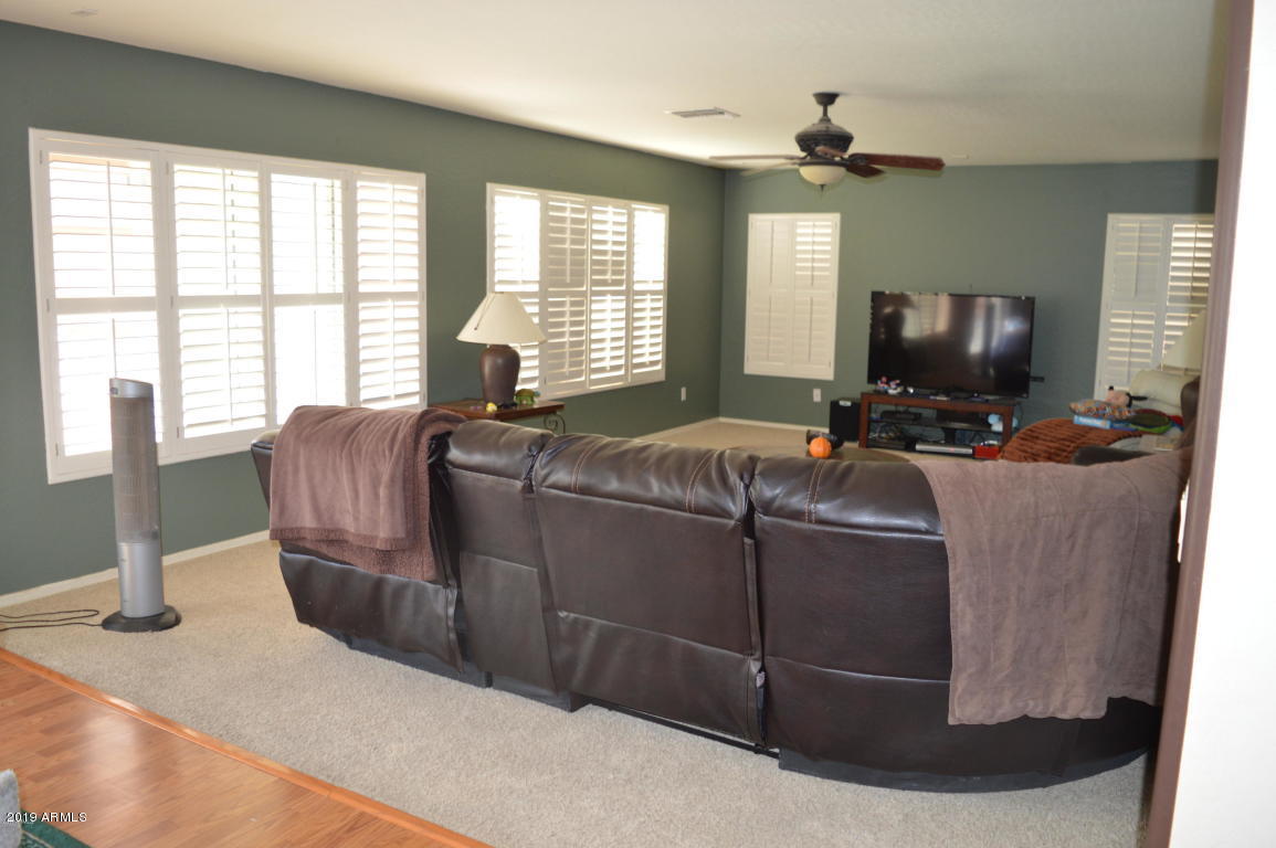 4351 East Pinto Valley Road San Tan Valley, AZ 85143 - Photo 5 of 27 a living room with furniture and a flat screen tv
