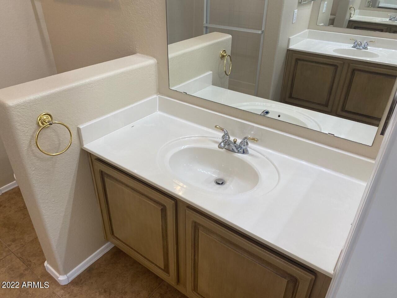 15225 North 100th Street, Unit 2188 Scottsdale, AZ 85260 - Photo 12 of 24 a bathroom with a sink vanity and a mirror