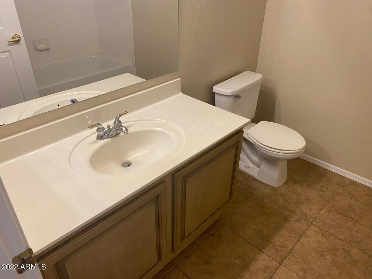 15225 North 100th Street, Unit 2188 Scottsdale, AZ 85260 - Photo 16 of 24 a bathroom with a sink and a toilet