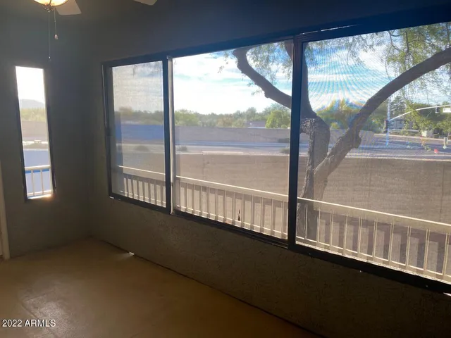 a view of an empty room with a large window