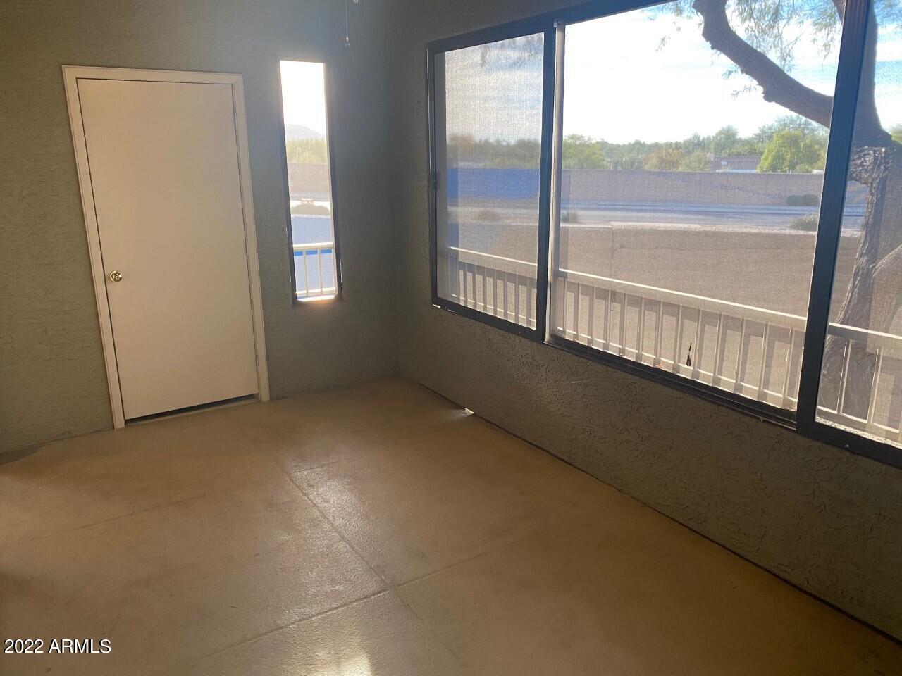 15225 North 100th Street, Unit 2188 Scottsdale, AZ 85260 - Photo 19 of 24 a view of an empty room with a large window