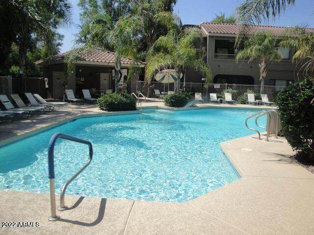 15225 North 100th Street, Unit 2188 Scottsdale, AZ 85260 - Photo 20 of 24 a front view of a house with garden