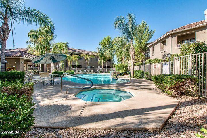 15225 North 100th Street, Unit 2188 Scottsdale, AZ 85260 - Photo 21 of 24 a front view of a house with a yard