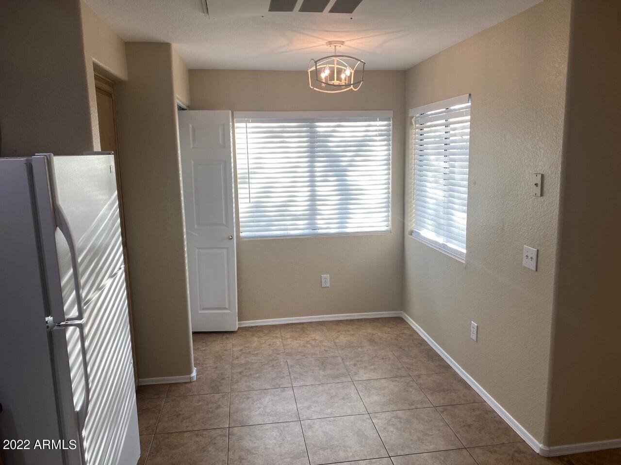 15225 North 100th Street, Unit 2188 Scottsdale, AZ 85260 - Photo 5 of 24 a view of an empty room with a window