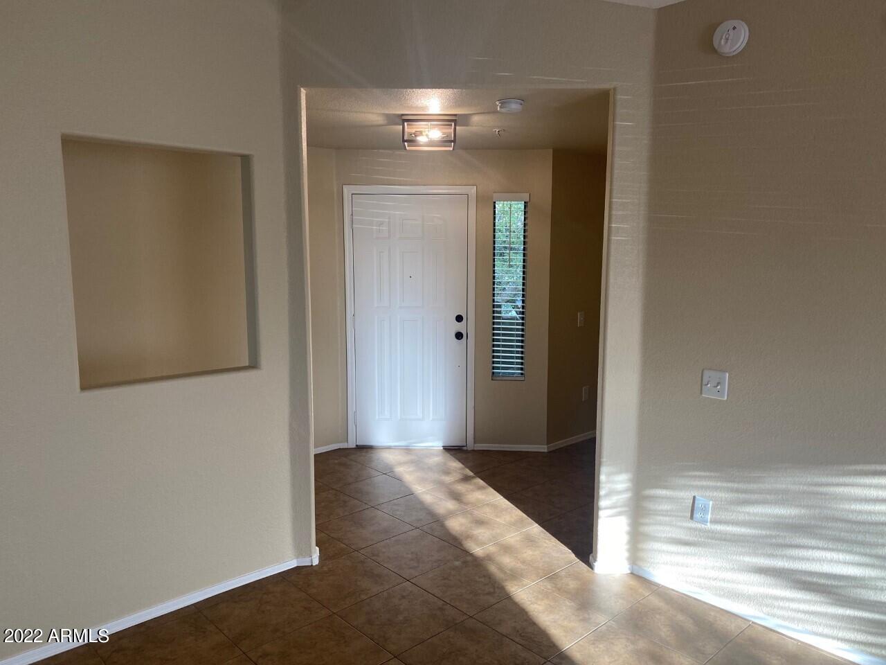 15225 North 100th Street, Unit 2188 Scottsdale, AZ 85260 - Photo 7 of 24 a view of a hallway with an entryway