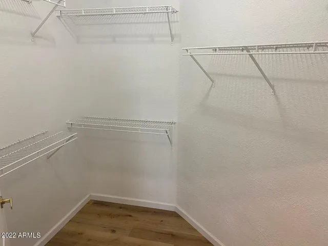 a view of a room with racks on the wall