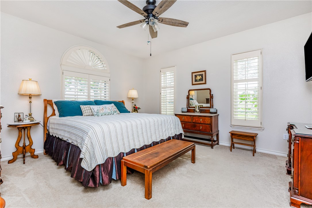 345 Trail Ridge Drive Sandia, TX 78383 - Photo 31 of 40 a bedroom with a bed and a chandelier