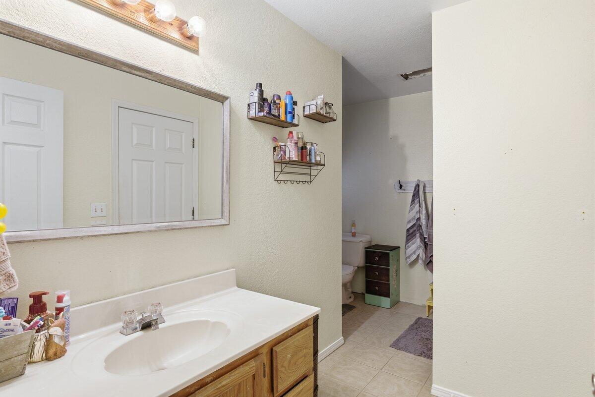 650 Sarah Lane Eagle Point, OR 97524 - Photo 13 of 19 a bathroom with a sink and a mirror