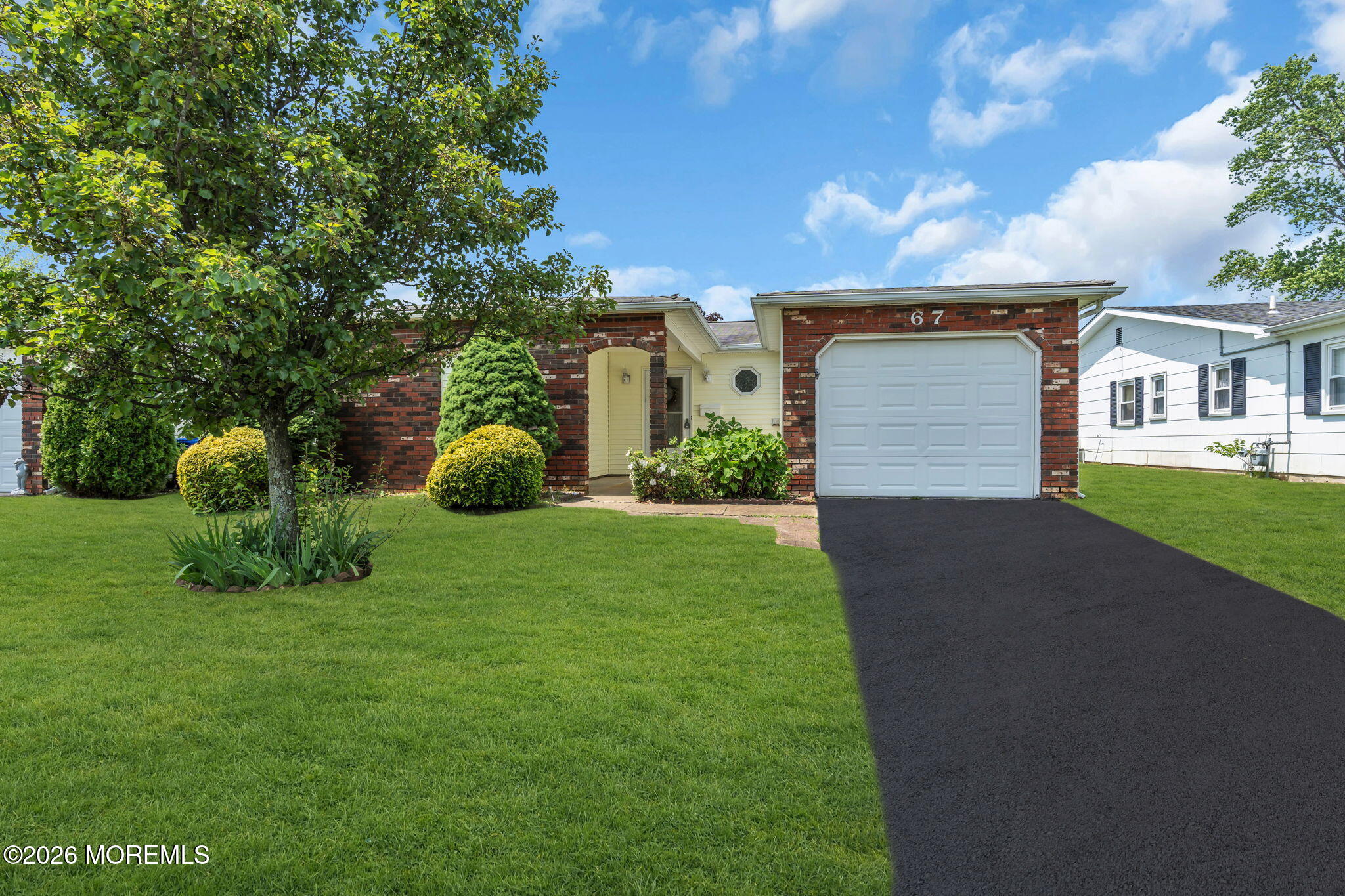 67 Blake Circle Brick, NJ 08724 - Photo 3 of 34 a front view of a house with garden
