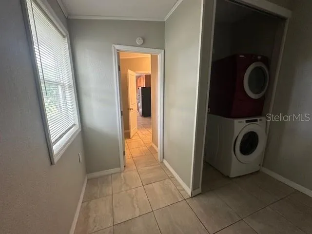 a view of a storage and utility room with washer and dryer