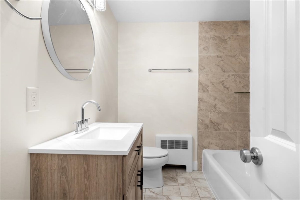 36 Grove Street Hanover, MA 02339 - Photo 17 of 25 a bathroom with a sink and a mirror