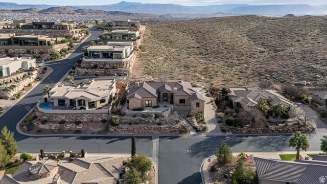 2464 East Granite Way St. George, UT 84790 - Photo 10 of 106 Aerial perspective of suburban area with a mountain backdrop