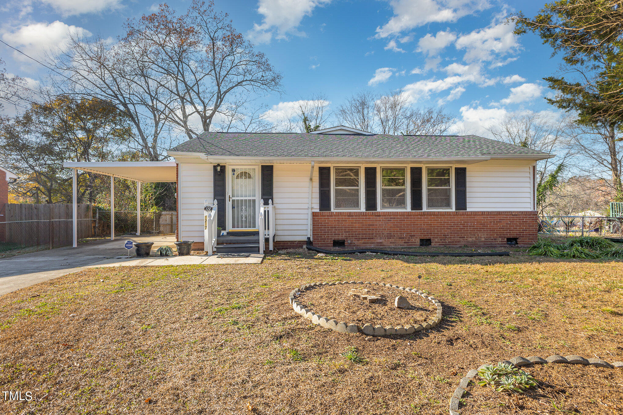 1217 Downing Road Raleigh, NC 27610 - Photo 1 of 13 a view of a house with a yard