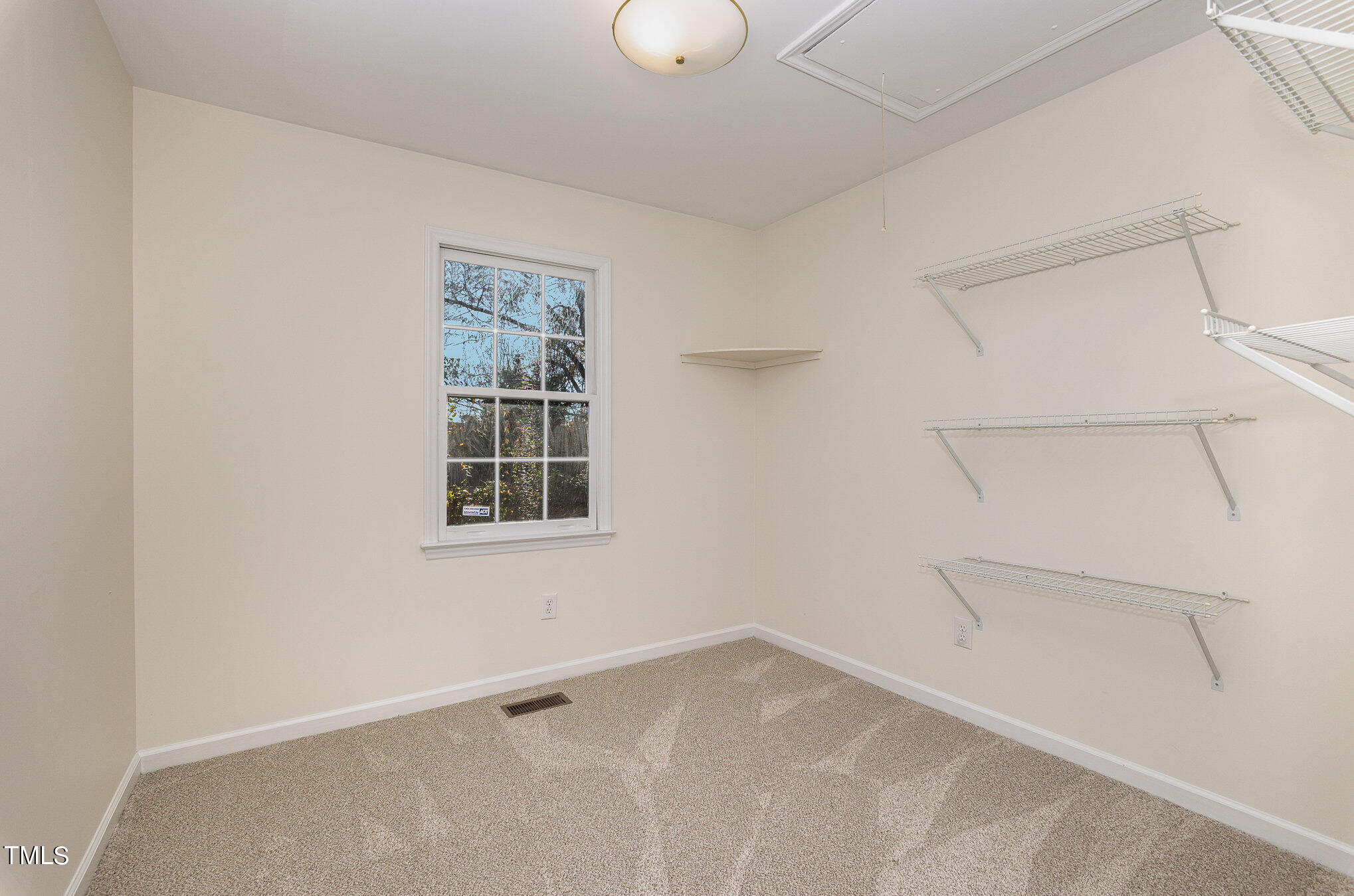 1217 Downing Road Raleigh, NC 27610 - Photo 8 of 13 a view of an empty room with a window