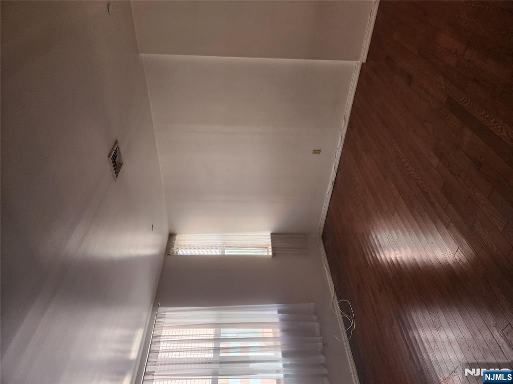840 River Road, Unit B2 Edgewater, NJ 07020 - Photo 13 of 13 an empty room with wooden floor and windows