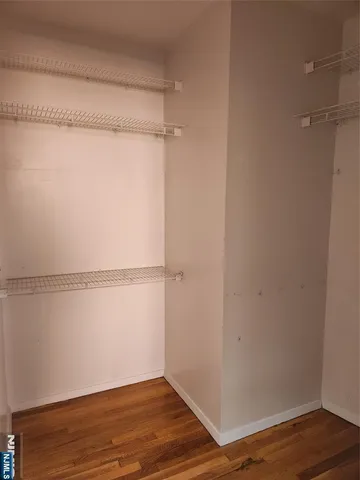 a view of an empty walk in closet