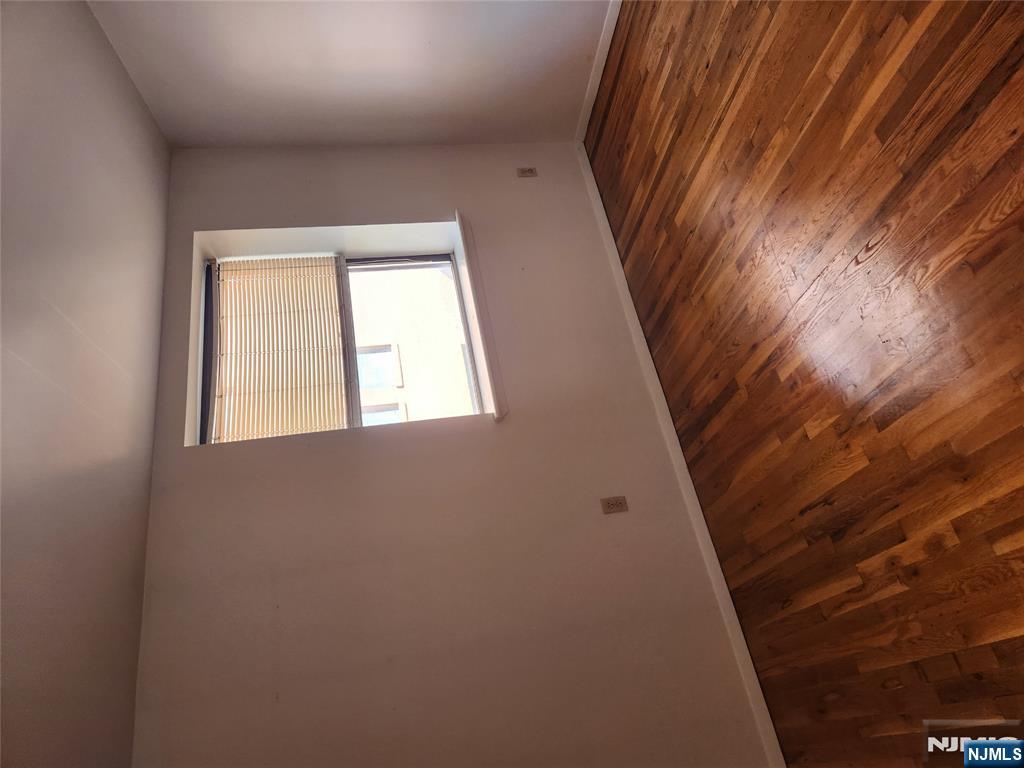 840 River Road, Unit B2 Edgewater, NJ 07020 - Photo 5 of 13 an empty room with a window