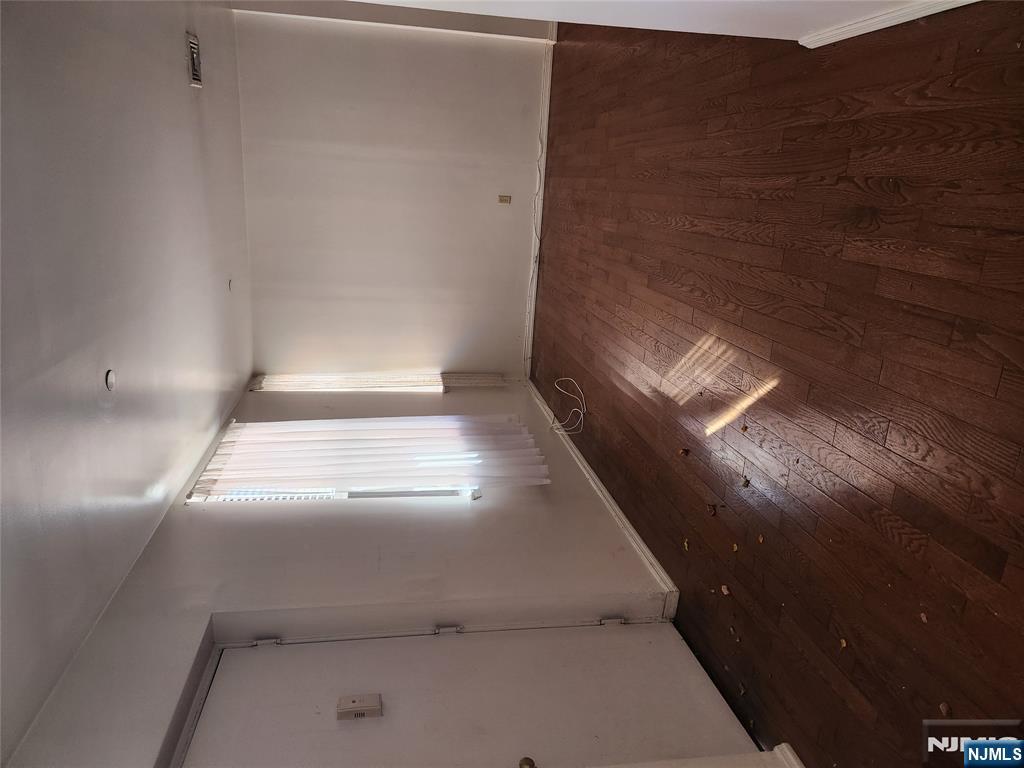 840 River Road, Unit B2 Edgewater, NJ 07020 - Photo 10 of 13 an empty room with wooden floor and windows