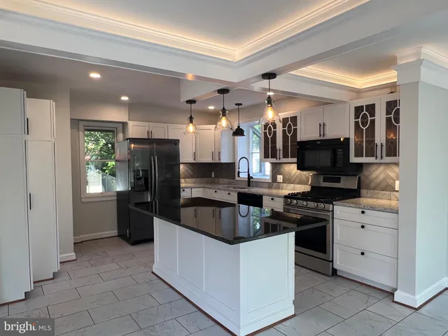 a view of a livingroom with an empty space and a window
