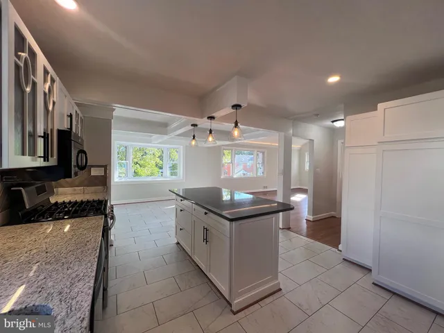 a view of a wooden deck and a backyard