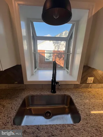 a bathroom with a sink double vanity and a mirror