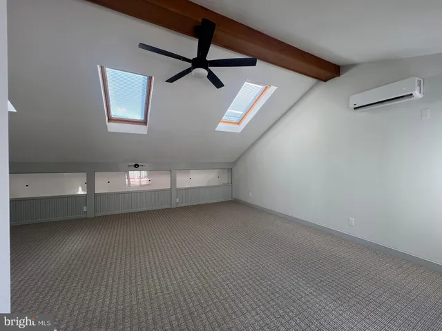 a bathroom with a sink a mirror and shower