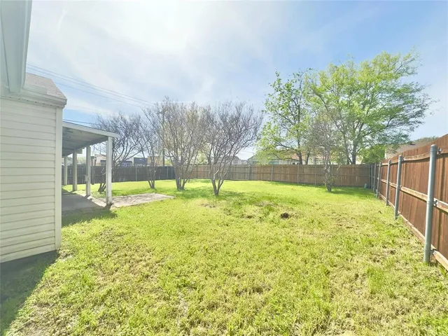a view of a backyard with a garden