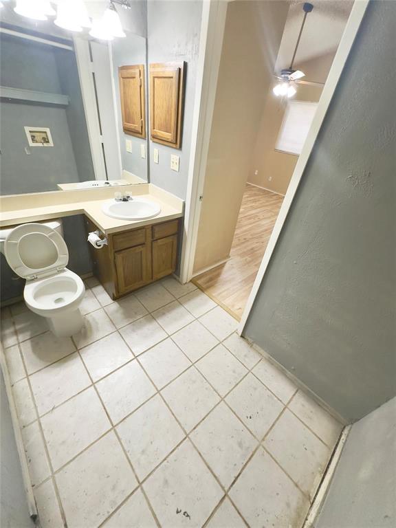 7401 Canoga Circle Fort Worth, TX 76137 - Photo 3 of 17 a bathroom with a sink toilet and mirror