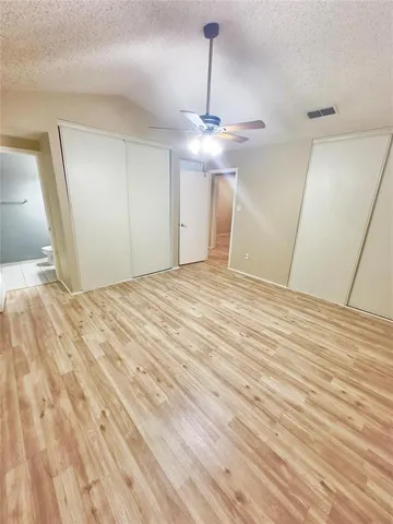 a view of an empty room with a chandelier