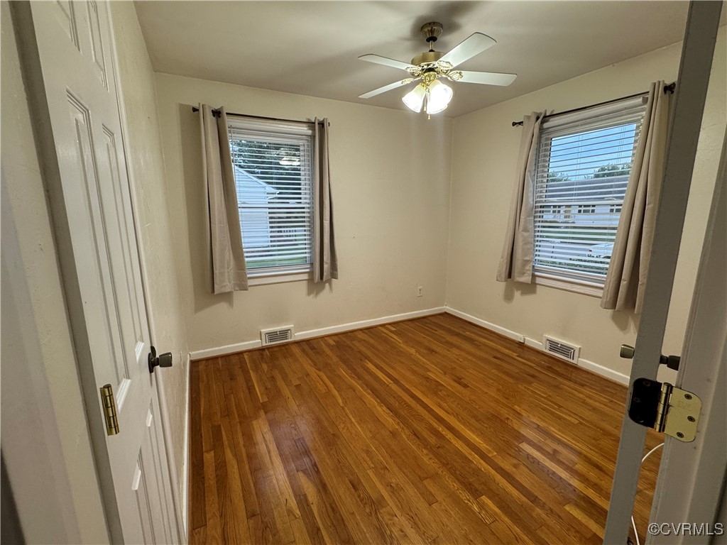 2708 Elgin Road Richmond, VA 23223 - Photo 3 of 8 Bedroom room with wood finished floors, and ceilin
