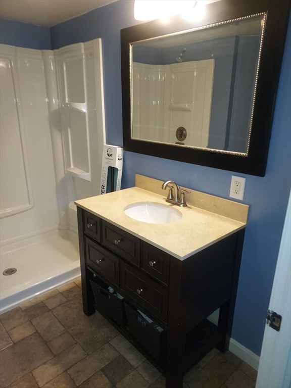 13 Daisy Avenue Taunton, MA 02780 - Photo 19 of 22 a bathroom with a sink vanity and a mirror