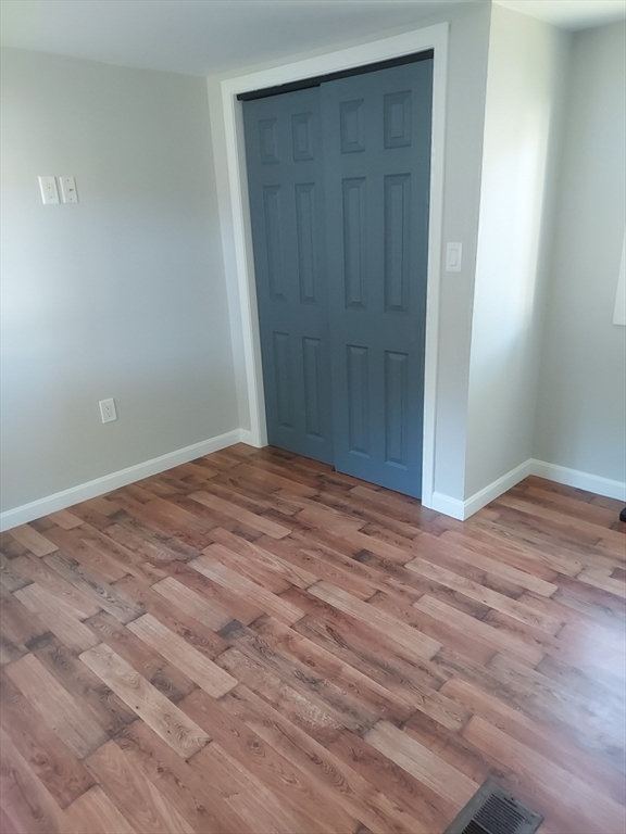13 Daisy Avenue Taunton, MA 02780 - Photo 20 of 22 an empty room with wooden floor