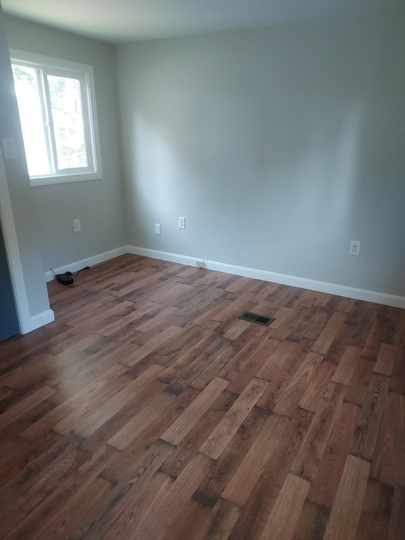 13 Daisy Avenue Taunton, MA 02780 - Photo 21 of 22 an empty room with wooden floor and windows