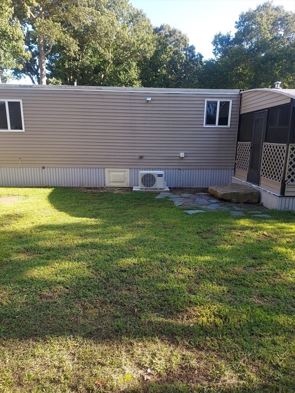 13 Daisy Avenue Taunton, MA 02780 - Photo 5 of 22 a view of a backyard with a garden and plants