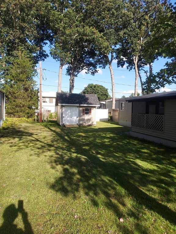 13 Daisy Avenue Taunton, MA 02780 - Photo 6 of 22 a backyard of a house with lots of green space