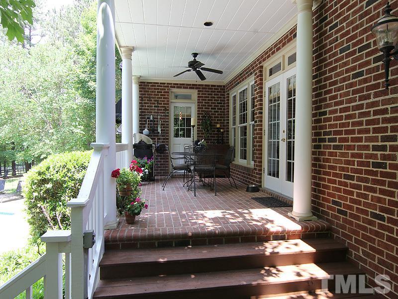 233 Markham Plantation Apex, NC 27523 - Photo 18 of 25 a view of a house with a flower garden