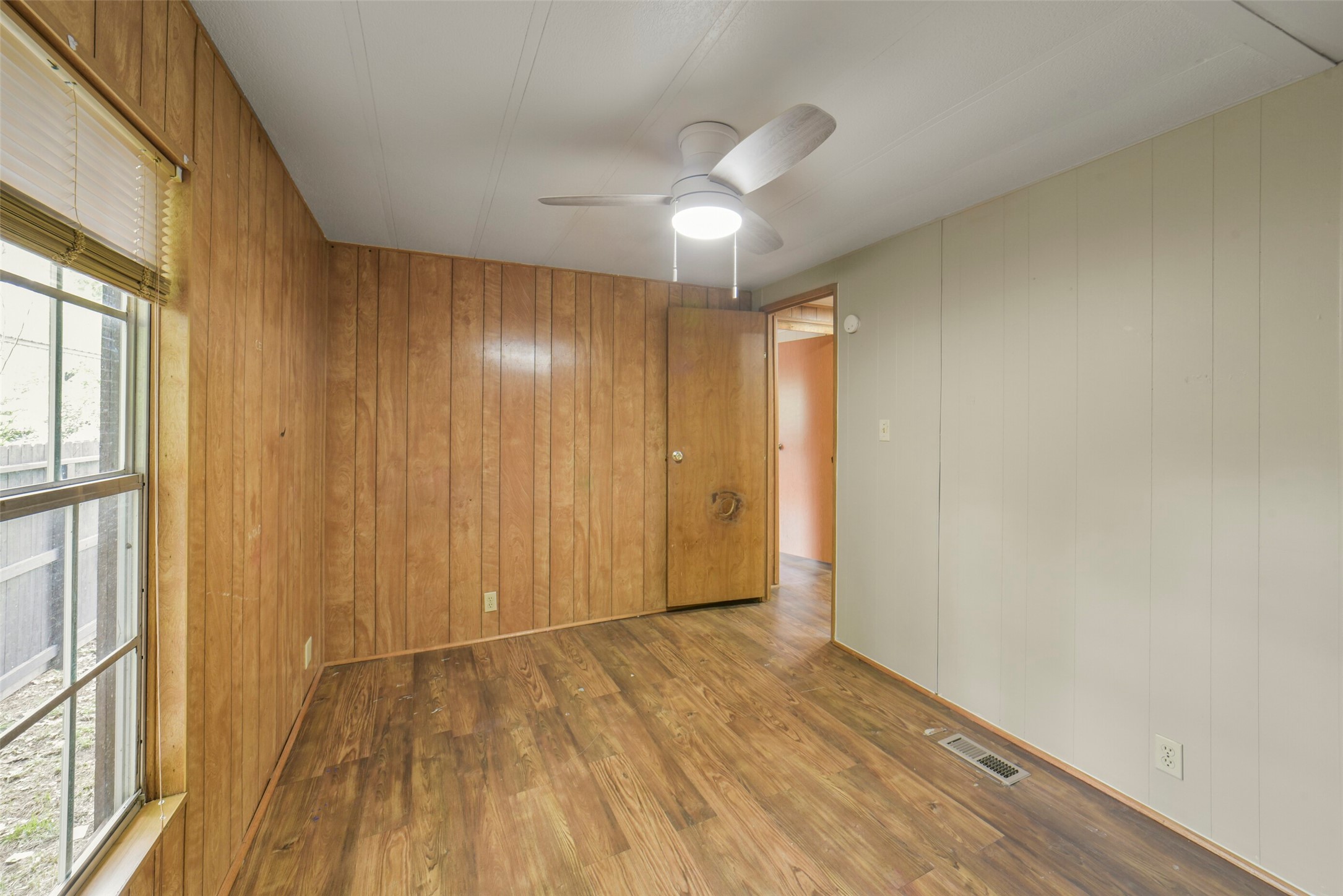 11023 Forrest Valley Drive Houston, TX 77065 - Photo 27 of 47 a view of empty room with wooden floor and fan
