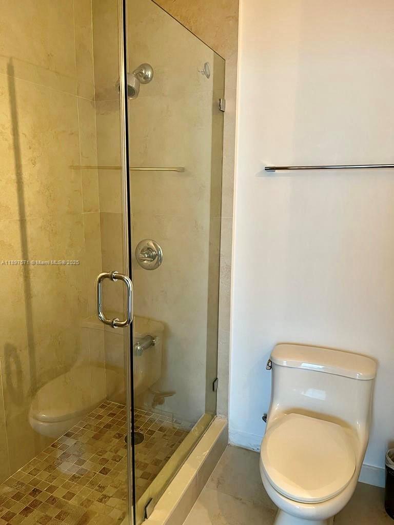 60 Southwest 13th Street, Unit 4607 Miami, FL 33130 - Photo 14 of 20 a bathroom with a toilet and a shower
